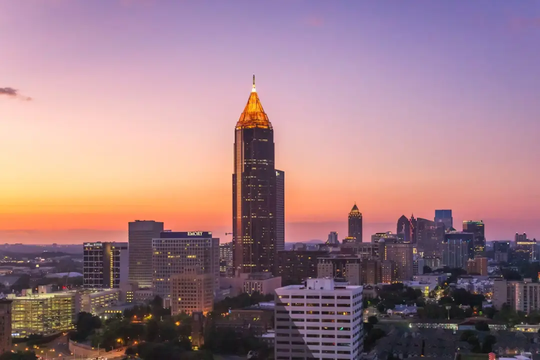 This is a beautiful photograph of the Atlanta, Georgia, city skyline at dusk or sunset.
