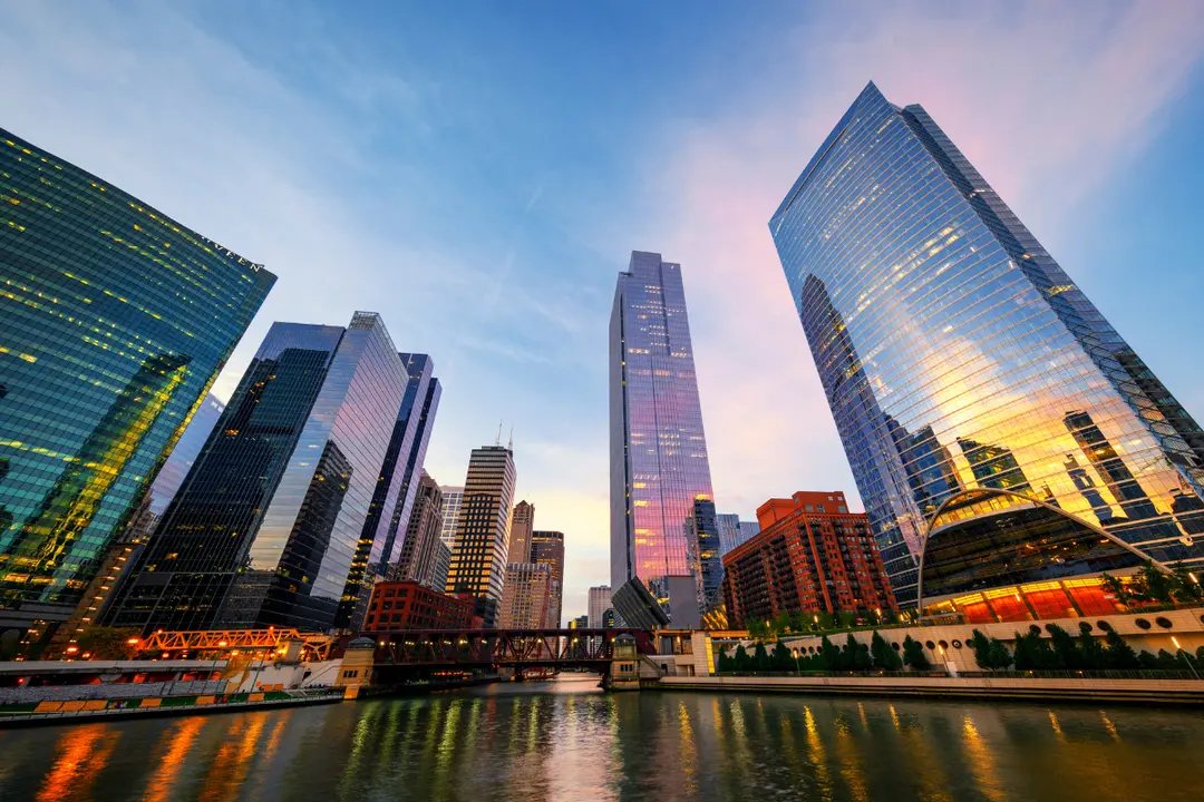 The scene shows a river running between modern skyscrapers — that layout is very characteristic of downtown Chicago, where the Chicago River cuts right through the financial and architectural core of the city.Good place for a Ghost Kitchen