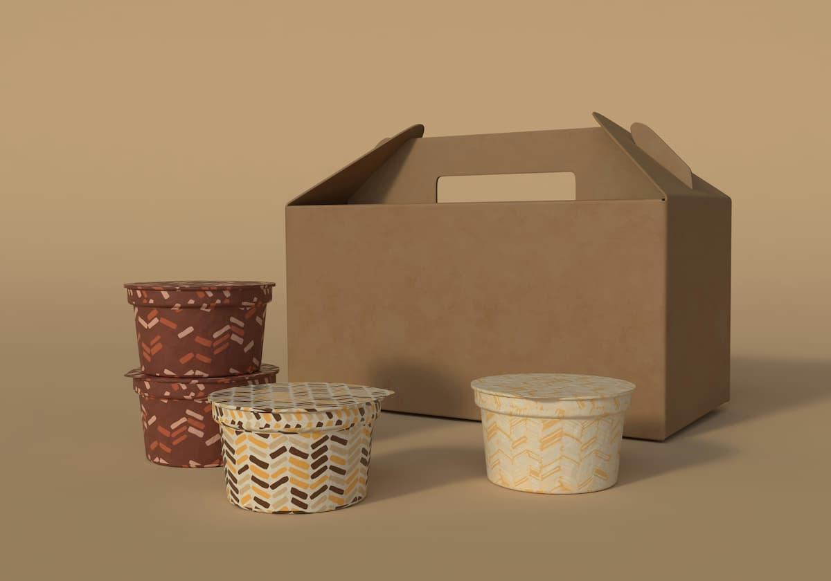 Unique food packing design showcasing four colorful containers with lids and a cardboard box. The containers feature patterns in brown, pink, and yellow tones, emphasizing creativity and practicality. The plain brown cardboard box includes a handle for easy transport.