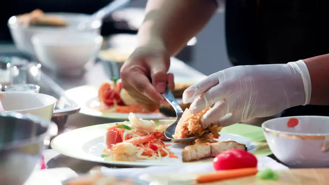 Preparing food in a catering business