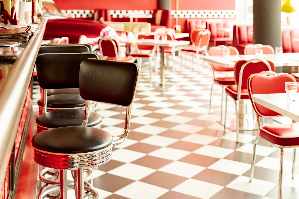 The image shows the interior of a classic American-style diner or restaurant.