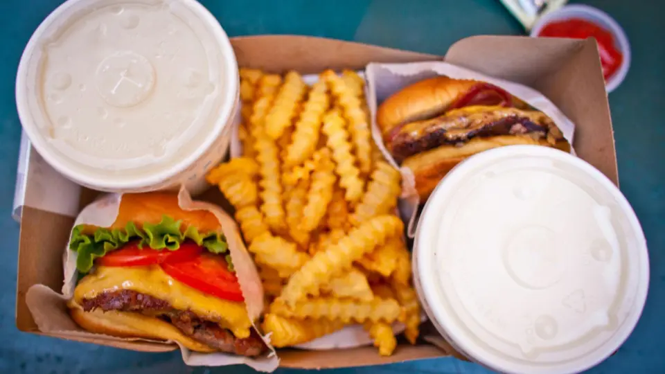 While Chicago is world-renowned for its culinary scene, the second image showcases a classic fast-food meal that mirrors the style of famous Chicago-based institutions like Shake Shack or local burger joints.