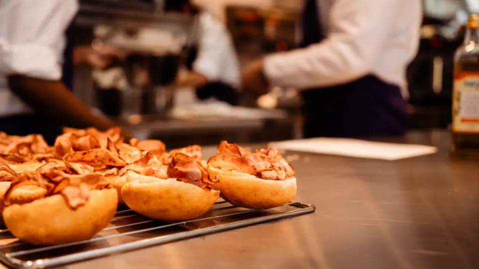This image provides a "behind-the-scenes" look at a busy professional kitchen during a high-volume food service.