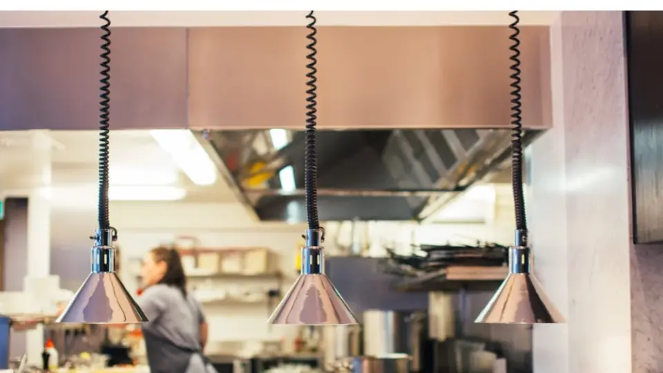 This image focuses on the industrial design and functionality of a kitchen's pass-through area.
