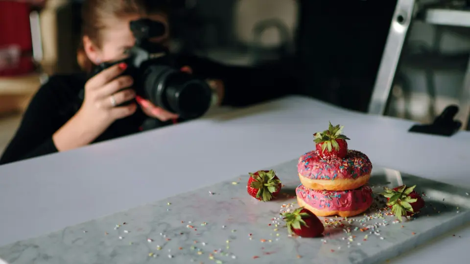 This image captures a behind-the-scenes moment of a professional food photography session.