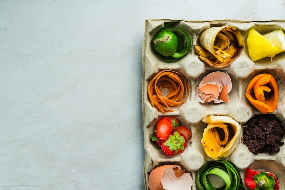 Tray with food scraps like fruit and vegetable peels.