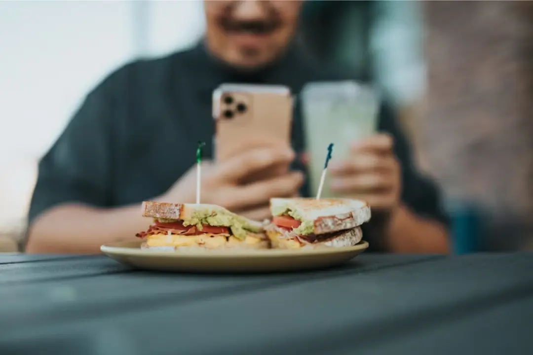 This image perfectly captures the power of visual marketing and user-generated content. It emphasizes the importance of presentation, ambiance, and digital engagement in promoting a food business.
