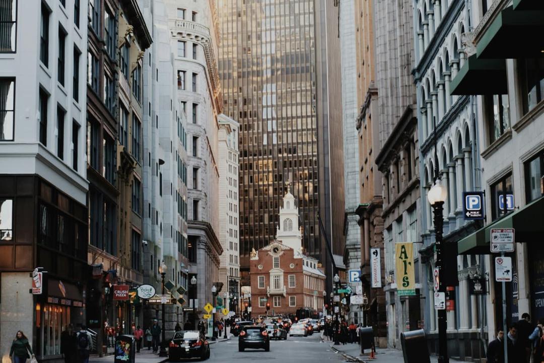 Busy downtown Boston street highlighting licensing mistakes to avoid when opening a kitchen in Boston.